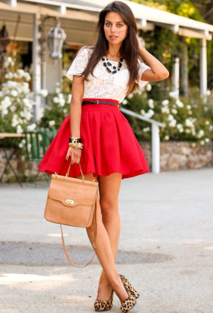 With white lace shirt, red skirt and leather bag