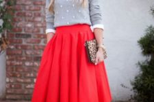 With white shirt, gray sweatshirt, leopard clutch and beige shoes