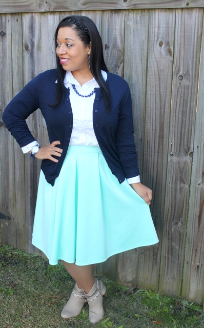 With white shirt, navy blue cardigan and gray boots