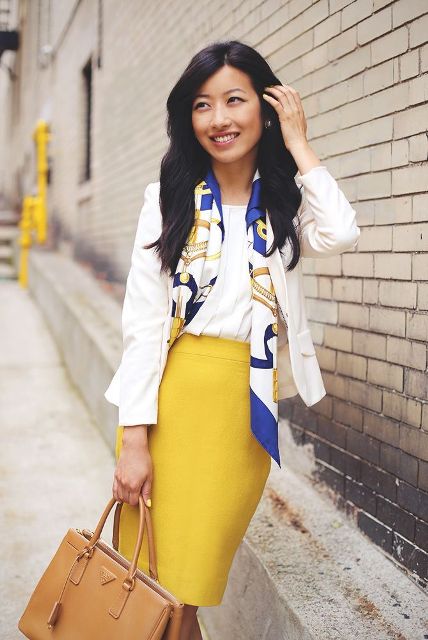 With white shirt, white jacket, camel bag and printed scarf