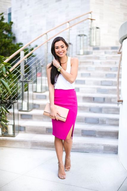 With white top, sandals and beige clutch
