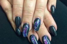 black nails with several amethyst nails