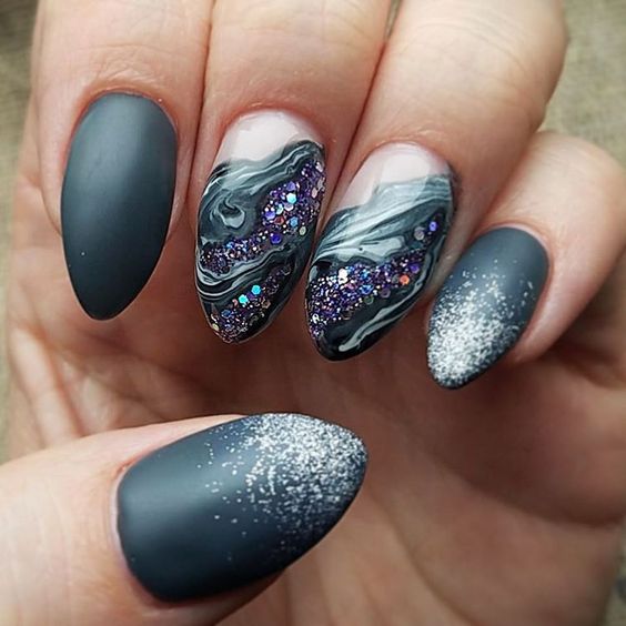 black nails with silver glitter and amethyst and marble detailing