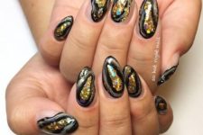 bold geode nails in black and gold glitter