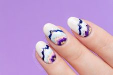 geode-inspired nails in white, purple and blue