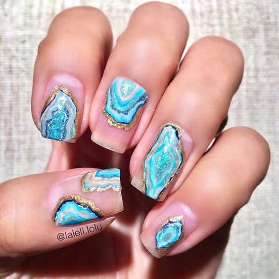 pink nails with turquoise and pearl geode decor