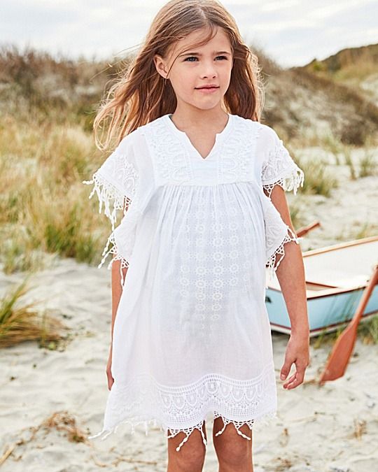 a cotton cover-up with fringe that can also double as a lightweight everyday layer