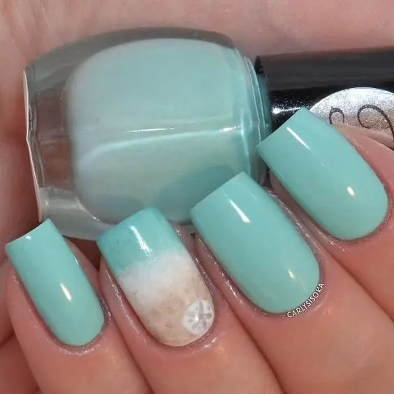 aqua nails with an accent one with beach sand decor and a starfish print