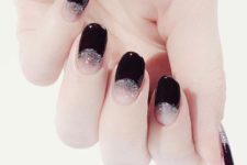05 black half moon nails with silver glitter for a glam feel