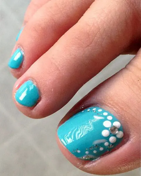 aqua-colored nails and some bead decor to sparkle