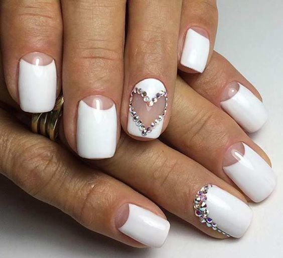 white half moon manicure with lots of rhinestones for a bride