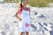 07 white shoulder tie beach cover up with a fish applique