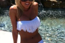 10 a white fringe top swimsuit with a cutout bottom