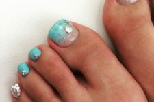 10 aqua-colored nails with silver starfish and shell accents
