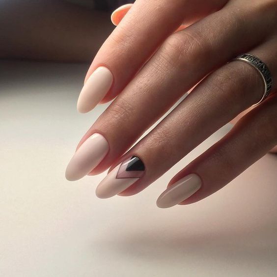 ivory nails and an accent chevron one with negative space and black