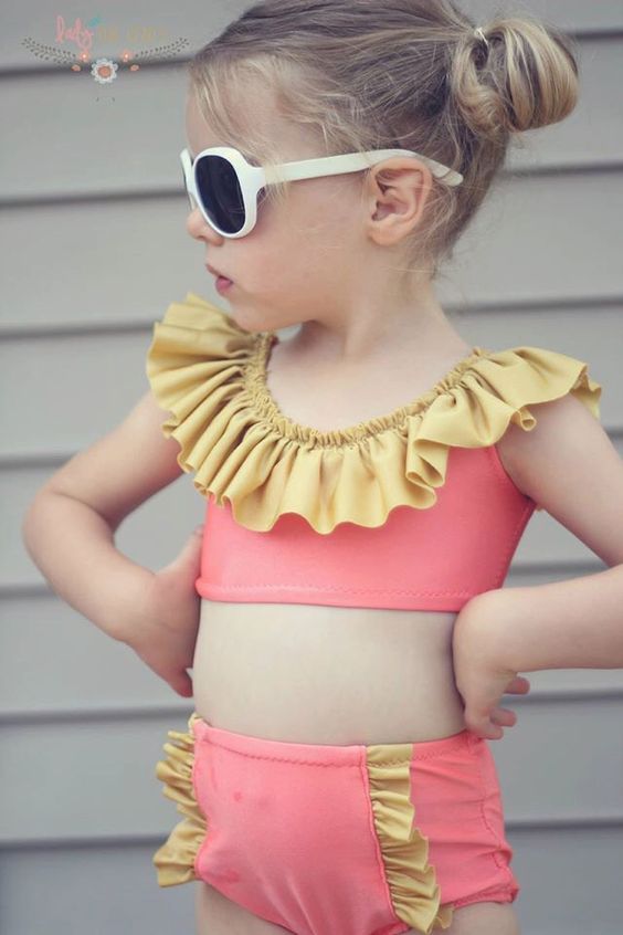 pink swimsuit with yellow ruffles here and there