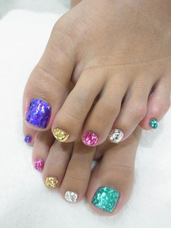 sequin toe nails, each of a different color to sparkle