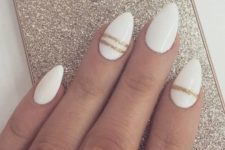 15 white nails with gold glitter thin stripes