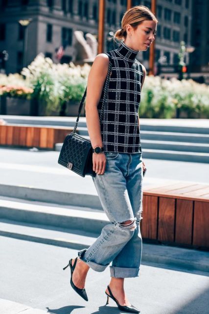 With checked top, cuffed jeans and black bag