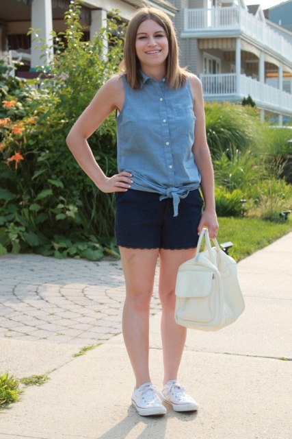 With denim shirt, white sneakers and white bag