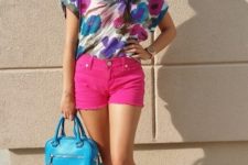With floral colorful blouse, blue bag and flat shoes