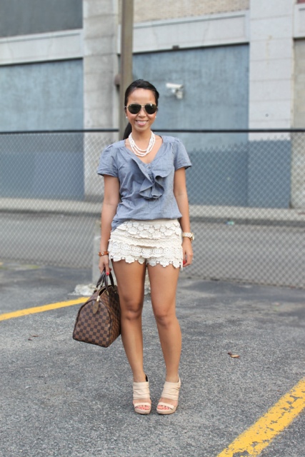 With gray shirt, beige shoes and printed bag