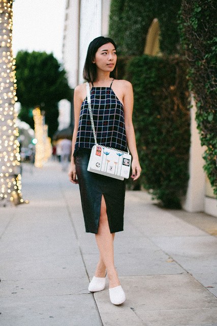 With green skirt, white shoes and printed bag