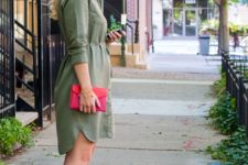 With olive green shirtdress and red clutch