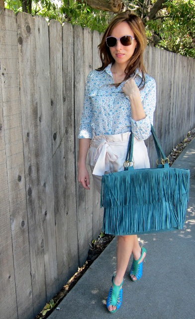 With printed blouse, turquoise bag and sandals
