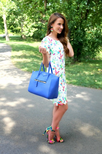 With printed dress and blue bag