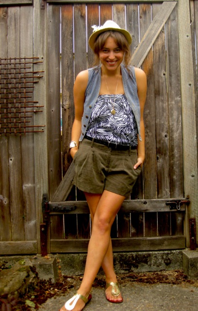 With printed top, gray vest and metallic flat sandals