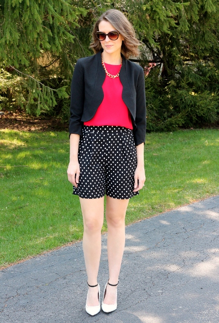 With red shirt, black blazer and white pumps
