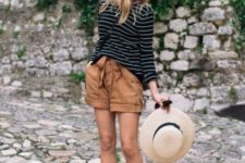 With striped loose shirt, black flats and wide brim hat