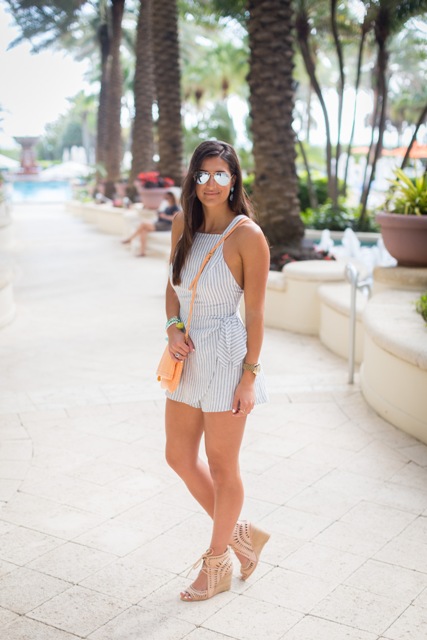 With sunglasses, beige crossbody bag and nude sandals