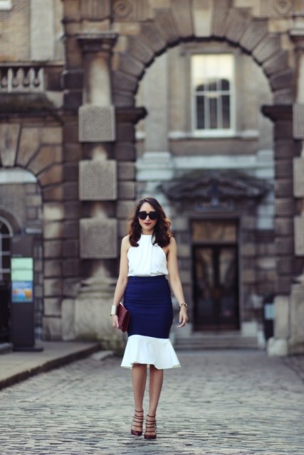 With white and blue skirt, heels and clutch
