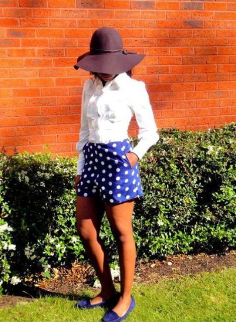 With white blouse, hat and blue flats