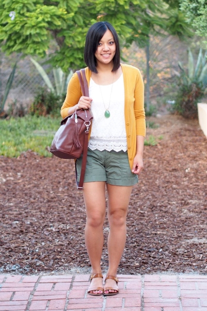 With white lace shirt, yellow cardigan, marsala bag and sandals