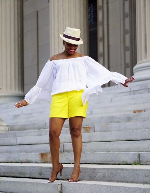 With white off the shoulder blouse, hat and brown shoes