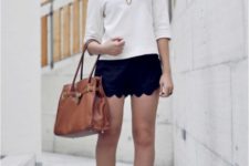 With white shirt, black heels and brown bag