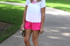 With white shirt, pink necklace and black mules