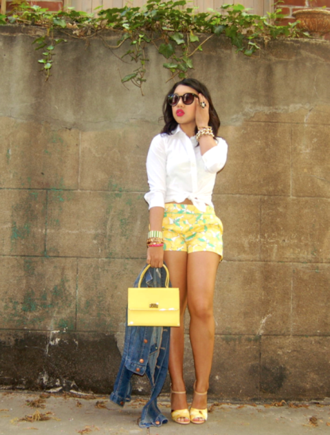 With white shirt, yellow small bag and yellow sandals