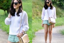 With white sweater, beige crossbody bag and heels