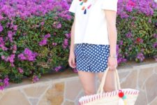 With white t-shirt, tassel necklace, straw tote and brown sandals