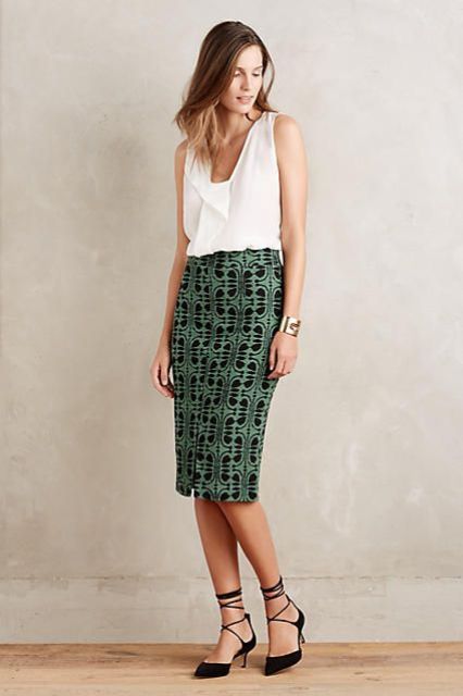 With white top and printed midi skirt