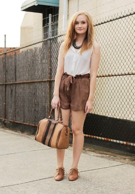 With white top, brown shoes and brown bag