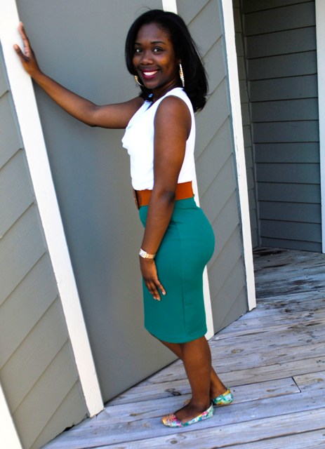 With white top, green pencil skirt and brown belt