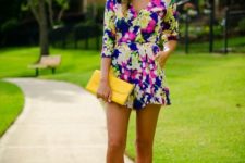 With yellow clutch and beige heels