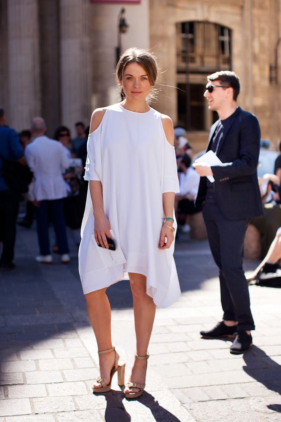 modern plain dress with a cold shoulder and an asymmetric edge, nude shoes