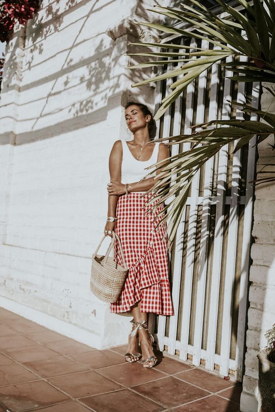 a red and white plaid ruffle skirt, a white top and ankle strap shoes
