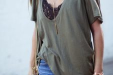 09 blue ripped jeans, a black lace top, an olive green oversized t-shirt